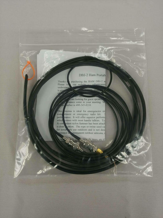 Ed Fong DBJ-2 ham antenna kit in its clear packaging, with coiled antenna, cable, adapters and instruction sheet.